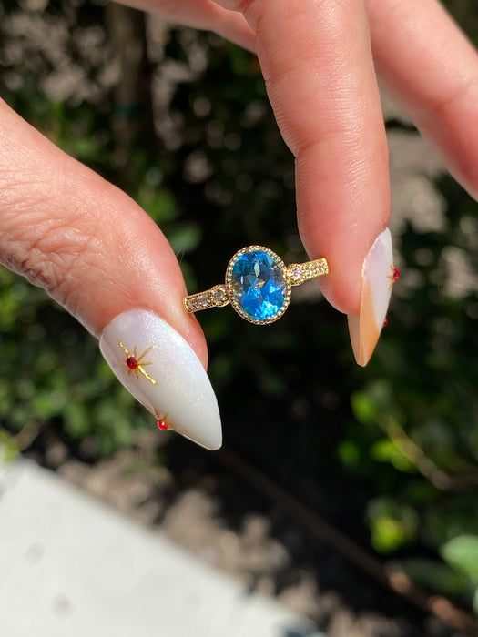 18K Gold Blue Topaz & Diamond Halo Ring