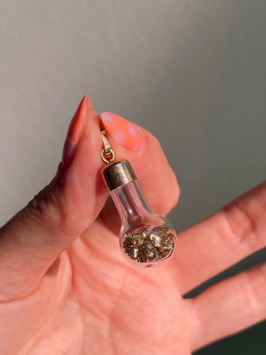 14k glass bottle with moving silver pieces inside charm pendant