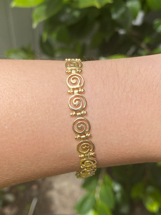 14K swirl bracelet 7.25”