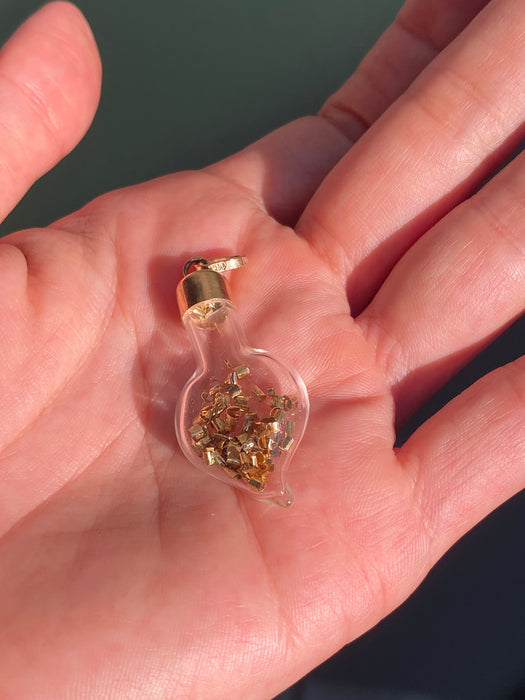 14k glass bottle with moving silver pieces inside charm pendant