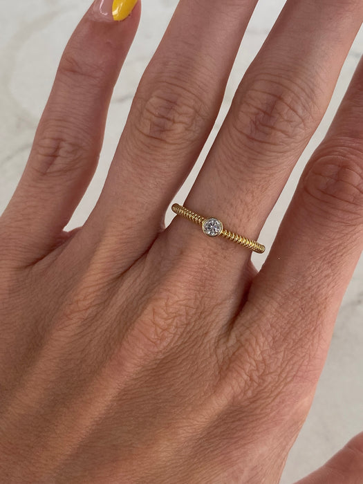 10K Gold Coiled Ring with Bezel-Set Diamond – 0.13 CTW