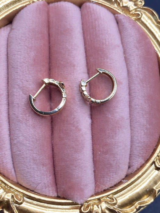 14k evil eye diamond Huggie earrings