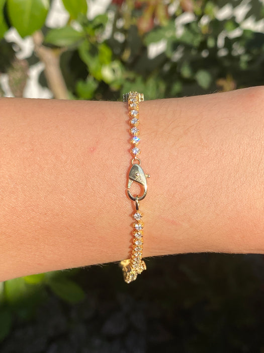 18k diamond flower tennis bracelet 7.25”