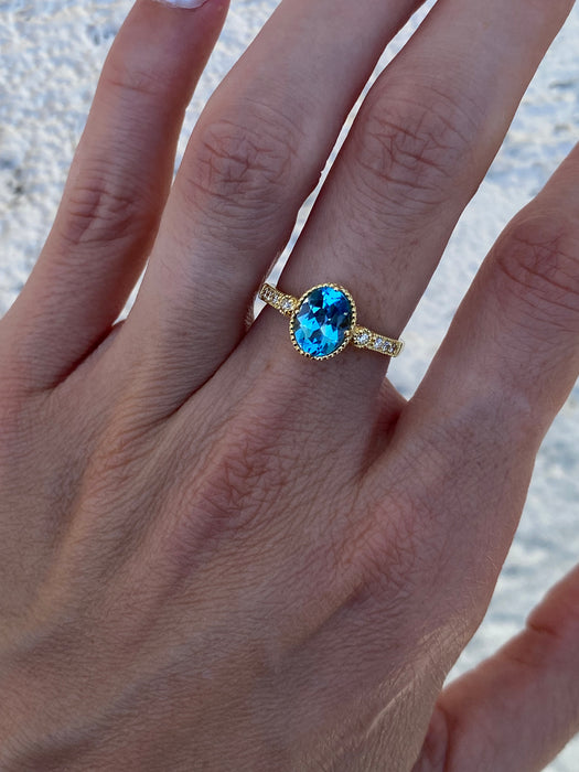 18K Gold Blue Topaz & Diamond Halo Ring