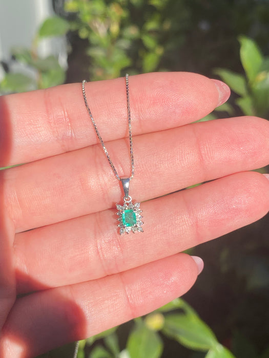 Platinum emerald and diamond pendant on chain