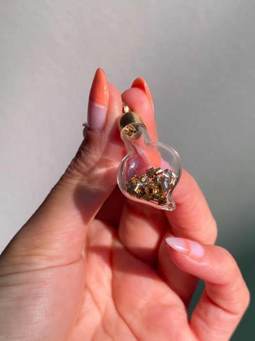 14k glass bottle with moving silver pieces inside charm pendant