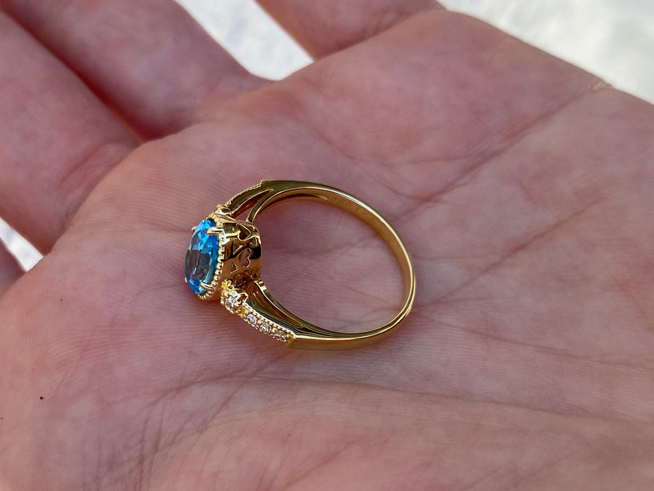 18K Gold Blue Topaz & Diamond Halo Ring
