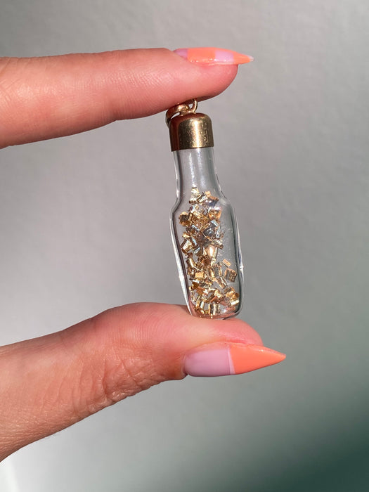 14k glass bottle with moving silver pieces inside charm pendant