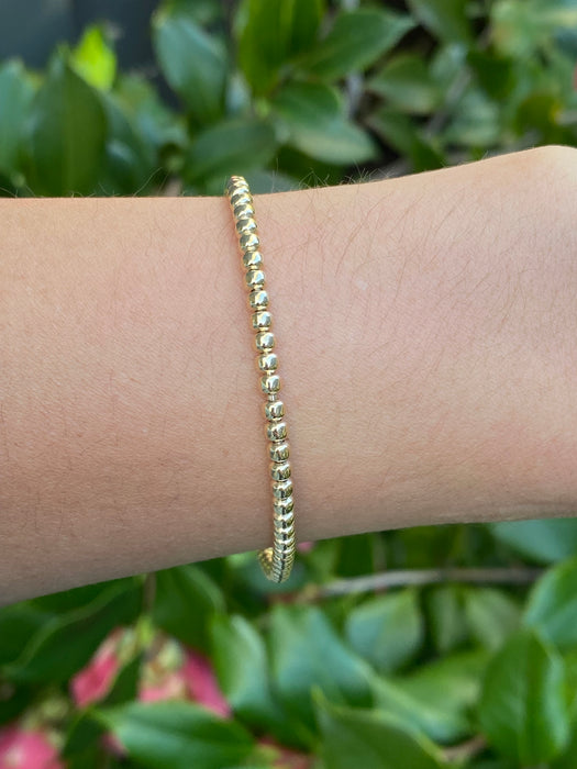 14k stretchy bead bracelet with diamond ball charm