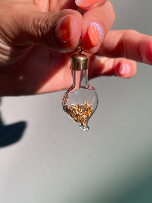 14k glass bottle with moving silver pieces inside charm pendant
