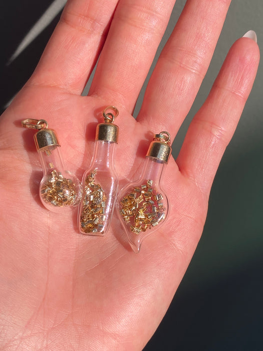 14k glass bottle with moving silver pieces inside charm pendant
