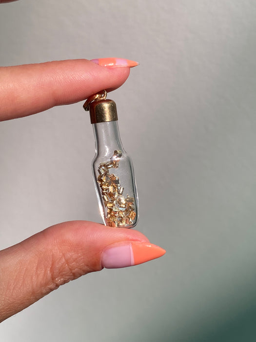 14k glass bottle with moving silver pieces inside charm pendant
