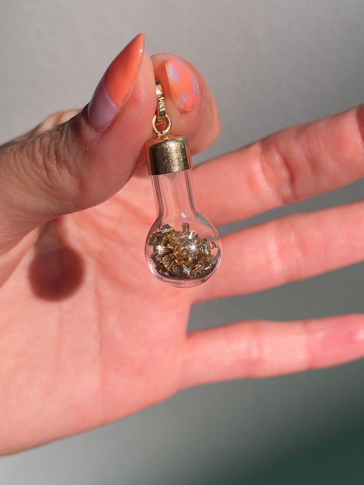 14k glass bottle with moving silver pieces inside charm pendant