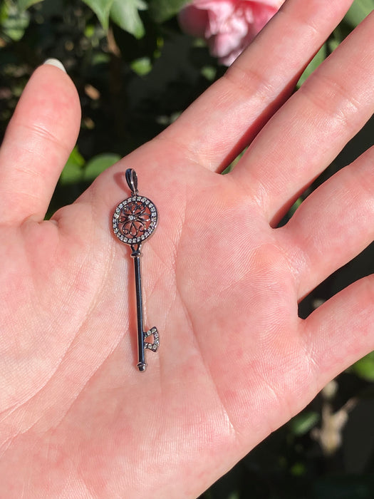 14k black rhodium flower diamond key pendant