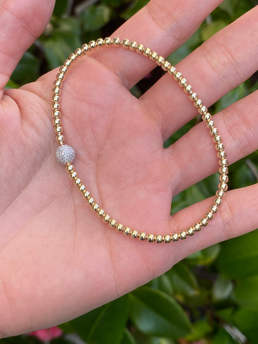 14k stretchy bead bracelet with diamond ball charm