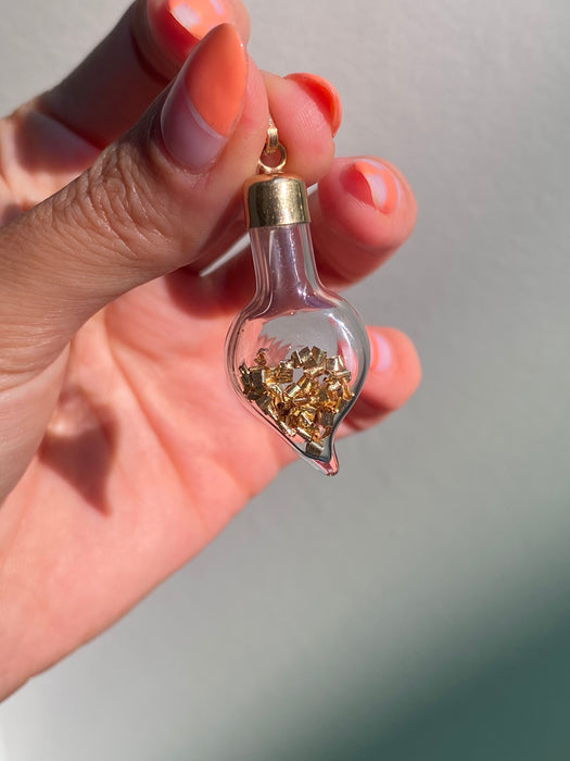 14k glass bottle with moving silver pieces inside charm pendant