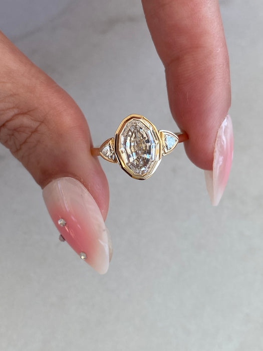 14K Gold Bezel Set Step-Cut Oval Lab Diamond Ring with Trillion Side Stones