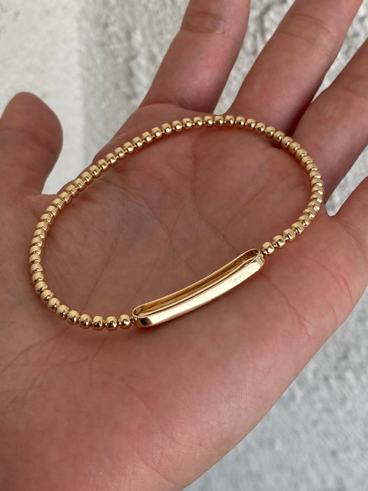 14k stretchy bead bracelet with diamond ID center