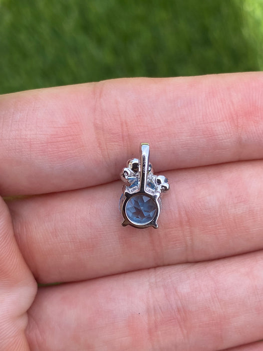 14k white gold blue topaz flower pendant