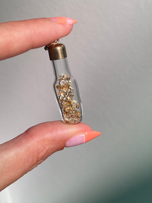 14k glass bottle with moving silver pieces inside charm pendant