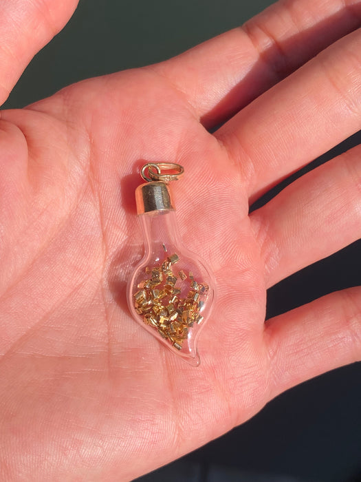 14k glass bottle with moving silver pieces inside charm pendant