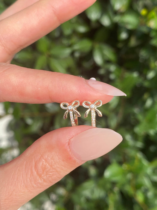 14k diamond bow huggie earrings